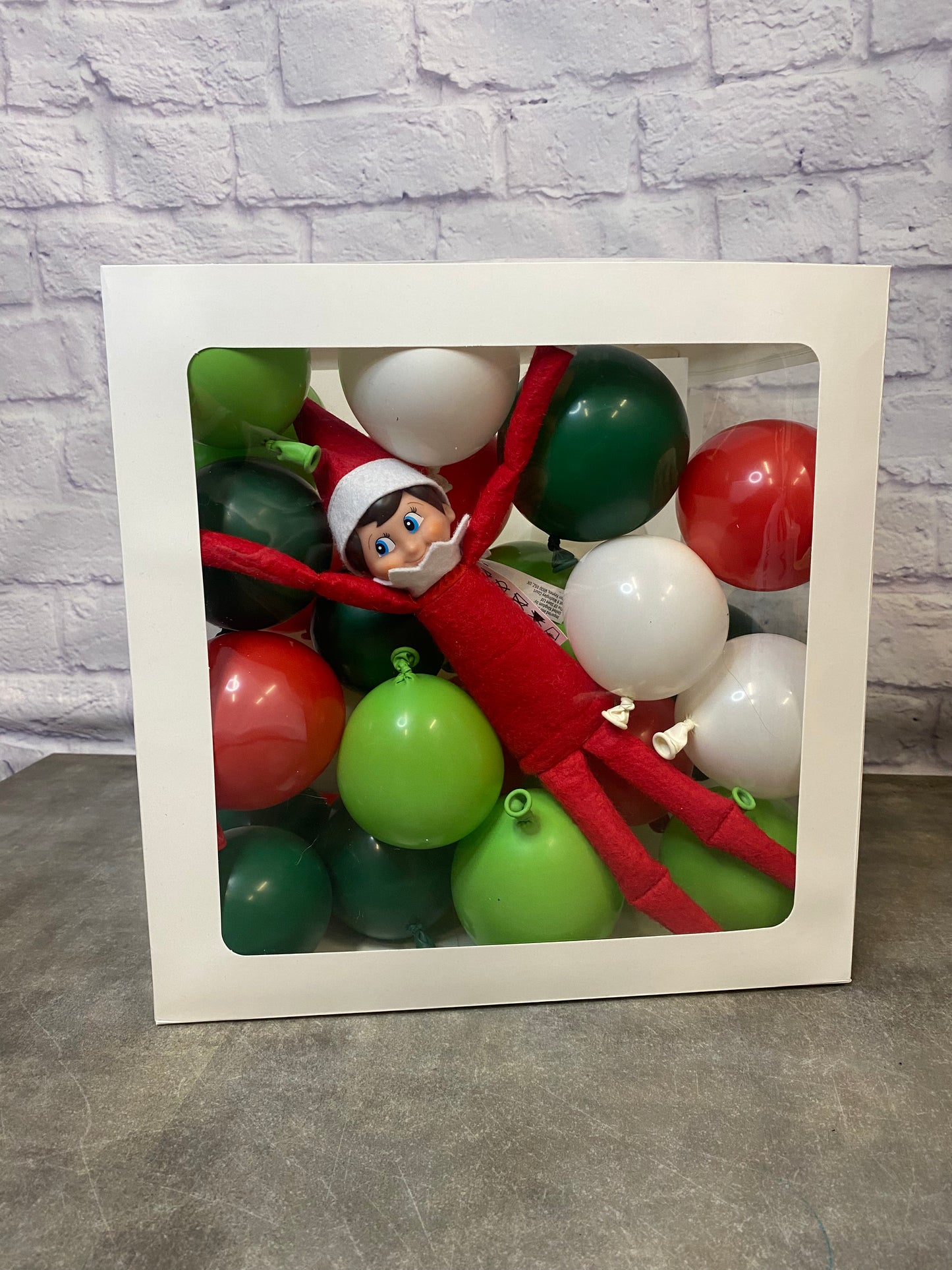 Elf On The Shelf Stuck in Box of Balloons